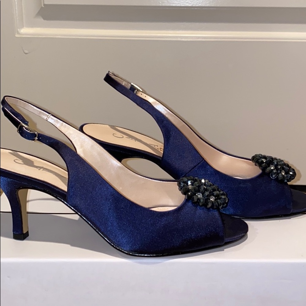 Timeless royal blue satin peep toe heel.